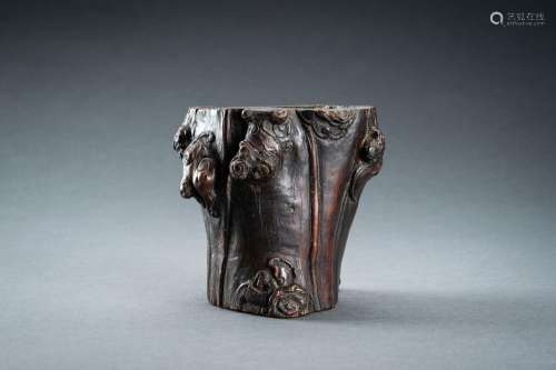 A WOOD “TREE TRUNK WITH BATS AND LINGZHI” BRUSHPOT, BITONG, ...