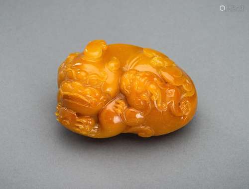 A ‘TIANHUANG’ GLASS FIGURE OF A BUDDHIST LION WITH CUB, c. 1...