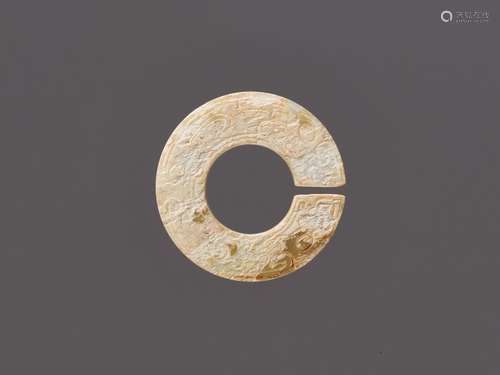 A RARE PALE CELADON JADE SLIT DISC, JUE, EASTERN ZHOU