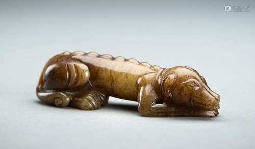 A CELADON AND BROWN JADE FIGURE OF A DOG, QING