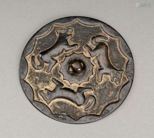 A RARE TANG DYNASTY BRONZE MIRROR WITH WOLFES