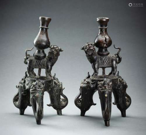 A PAIR OF FIGURAL CHINESE BRONZE LAMP STANDS, MING DYNASTY