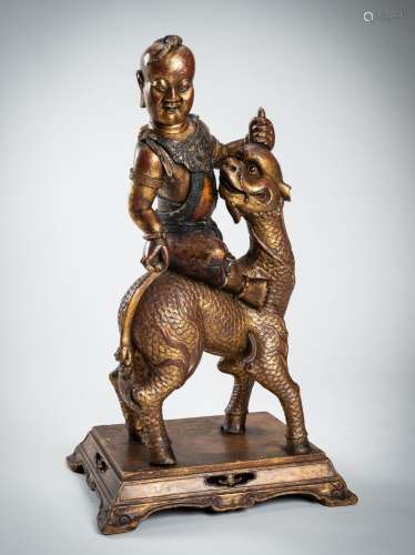A VERY LARGE GILT-LACQUERED WOOD STATUE OF YOUNG BUDDHA RIDI...