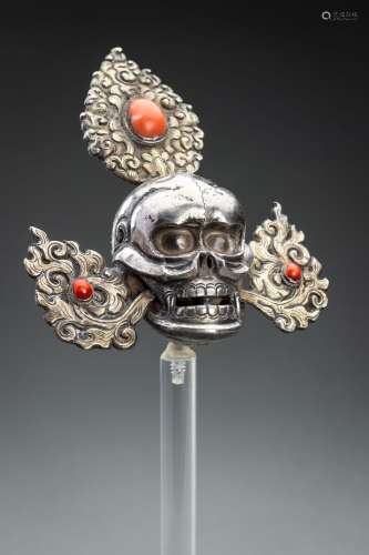 A PARCEL-GILT SILVER SKULL, PART OF AN ORACLE’S CROWN