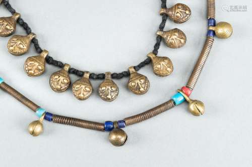 TWO NEPALI BRASS NECKLACES WITH BELLS, c. 1900s