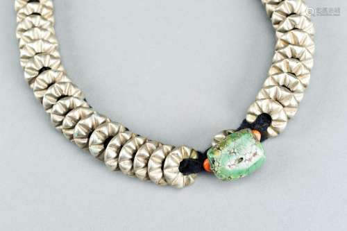 A HIMALAYAN NECKLACE WITH SILVER DISCS AND TURQUOISE, c. 190...