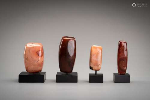 A GROUP OF FOUR LARGE ANTIQUE AGATE BEADS