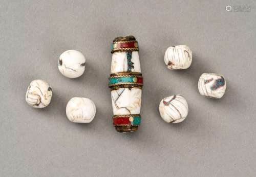 A GROUP OF SEVEN HIMALAYAN CONCH BEADS INLAID WITH TURQUOISE