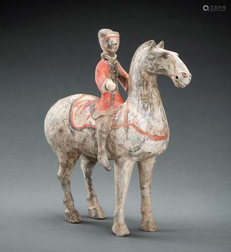 A POTTERY FIGURE OF AN EQUESTRIAN, HAN DYNASTY