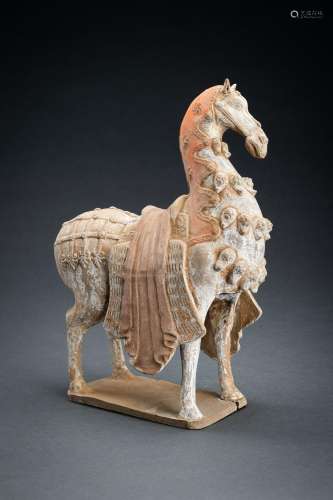 A PAINTED NORTHERN WEI POTTERY FIGURE OF A CAPARISONED HORSE