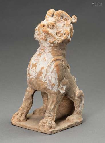A POTTERY FIGURE OF A HORNED GUARDIAN BEAST, TANG DYNASTY OR...