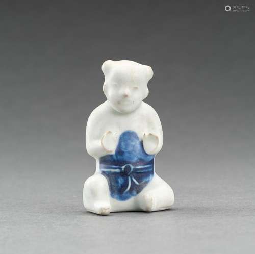 A GLAZED PORCELAIN FIGURE OF A BOY, QING DYNASTY