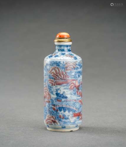 A BLUE, WHITE AND IRON RED ‘SCHOLARS’ PORCELAIN SNUFF BOTTLE...