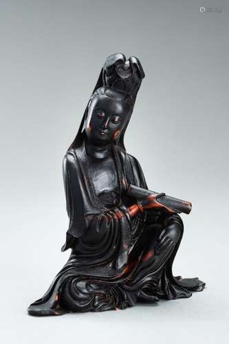 A BUFFALO HORN FIGURE OF GUANYIN