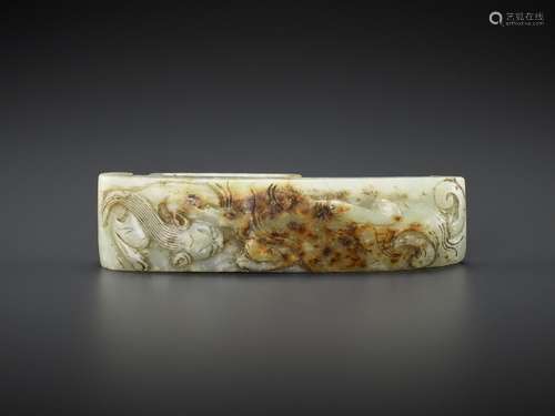 AN ARCHASITIC JADE SCABBARD SLIDE WITH DRAGON AMID CLOUDS, E...