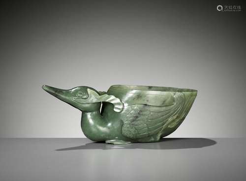 A SPINACH GREEN JADE ‘DUCK’ LIBATION CUP, QING DYNASTY