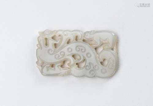 A CELADON-WHITE JADE ‘DRAGON AND TAPIR’ PENDANT, QING DYNAST...