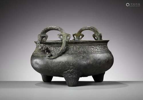 A LARGE BRONZE ‘CHILONG HANDLE’ TRIPOD CENSER, QING DYNASTY