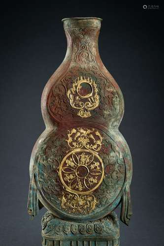 A LARGE ARCHAISTIC PARCEL GILT COPPER REPOUSSÉ DOUBLE GOURD ...