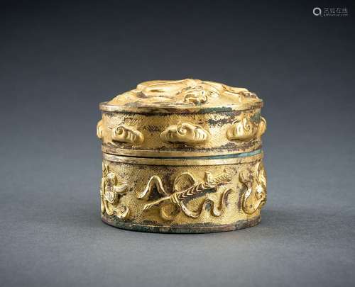 AN ARCHAISTIC FIRE-GILT COPPER REPOUSSÉ BOX WITH BUDDHIST SY...