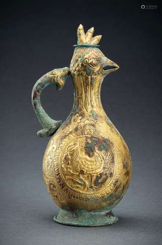 AN ARCHAISTIC FIRE-GILT COPPER REPOUSSÉ EWER WITH BIRD HEAD