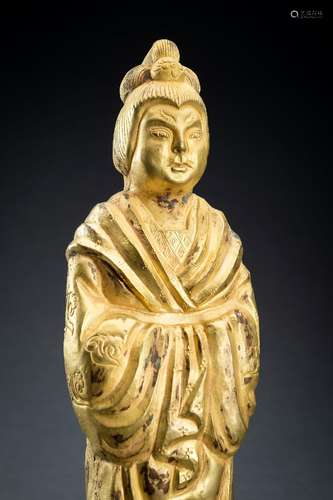 AN ARCHAISTIC FIRE-GILT COPPER REPOUSSÉ FIGURE OF A COURT LA...