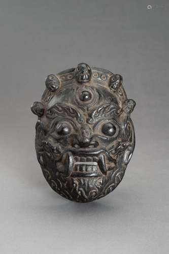 A BLACK LACQUERED WOOD MASK OF BHAIRAVA