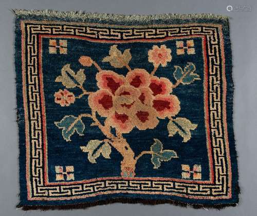 A SMALL ‘FLORAL’ TIBETAN RUG, c. 1900