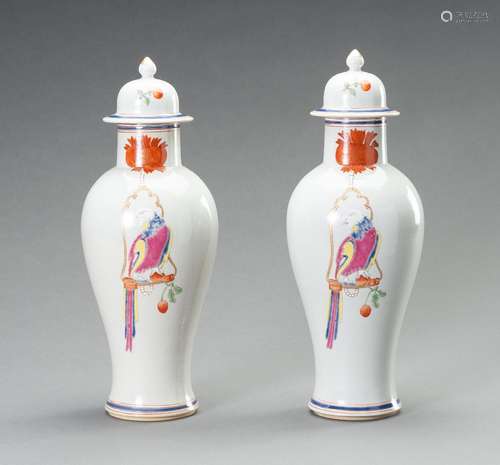 A PAIR OF FAMILLE ROSE ‘PARROT ON PERCH’ BALUSTER VASES, QIN...