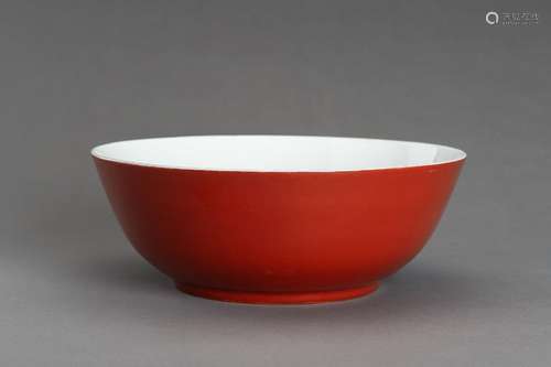 A LARGE COPPER-RED GLAZED PORCELAIN BOWL