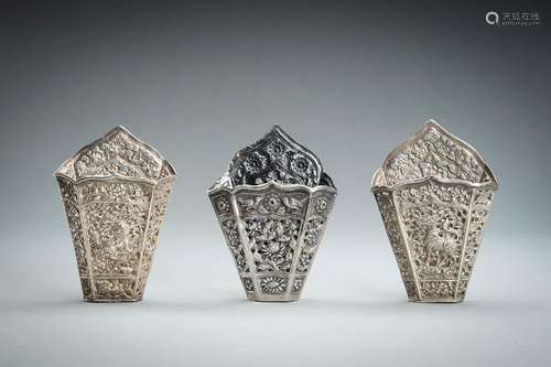 A GROUP OF THREE EMBOSSED SILVER BETEL LEAF HOLDERS, c. 1900...