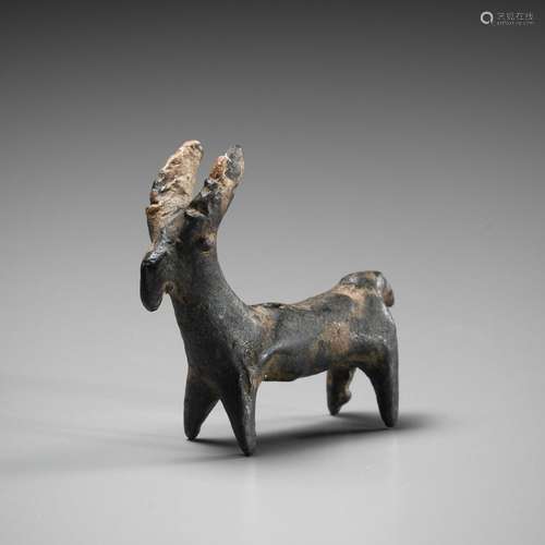 A SMALL LURISTAN BRONZE IBEX, CIRCA EARLY 1ST MILLENNIUM BC ...