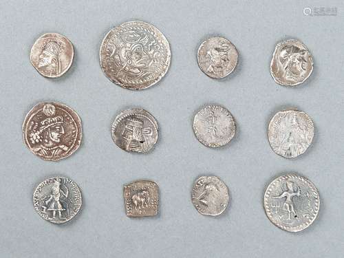 A GROUP OF 12 SILVER COINS