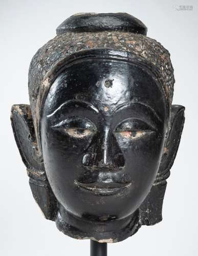 A LARGE LACQUERED SANDSTONE HEAD OF BUDDHA, 16th – 17th CENT...
