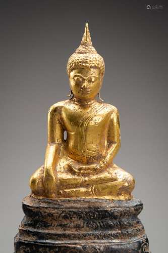 A THAI GOLD AND SILVER FOIL SUKHOTHAI STYLE FIGURE OF BUDDHA...