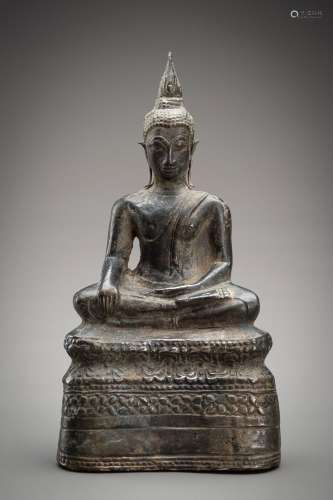 A THAI SILVER FOIL SUKHOTHAI STYLE FIGURE OF BUDDHA SHAKYAMU...