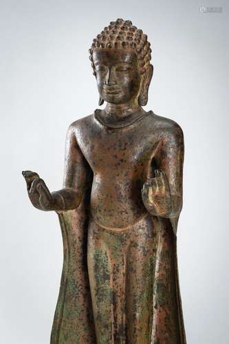 A LARGE BRONZE FIGURE OF A STANDING BUDDHA