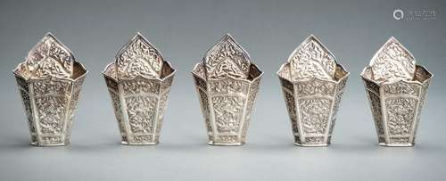 A GROUP OF FIVE EMBOSSED SILVER BETEL LEAF HOLDERS, c. 1900s