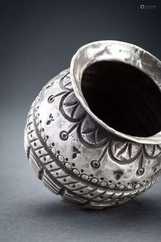 AN EMBOSSED TRIBAL SILVER KALASH