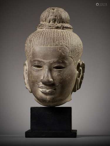 A SANDSTONE HEAD OF AVALOKITESHVARA, ANGKOR PERIOD, BAPHUON ...