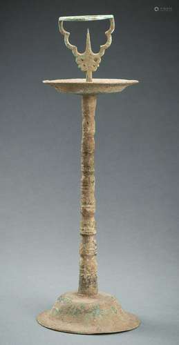 A CHAM BRONZE CANDLE HOLDER