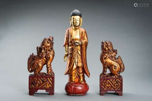 A VIETNAMESE GILT-LACQUERED WOOD FIGURE OF BUDDHA AND A PAIR...