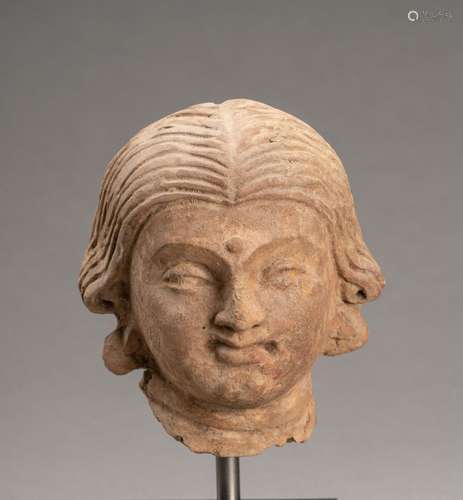 A TERRACOTTA HEAD OF A FEMALE BODHISATTVA, GANDHARA