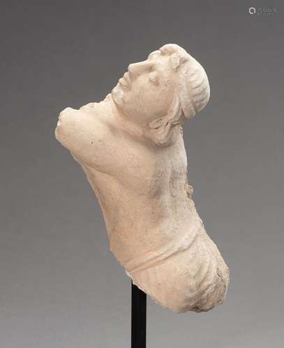 A STUCCO TORSO OF A MALE ADORANT, GANDHARA