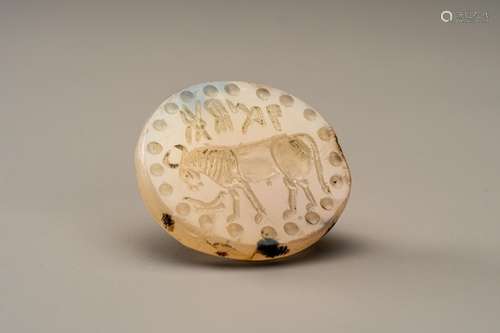 A BACTRIAN AGATE INTAGLIO SEAL DEPICTING A COW