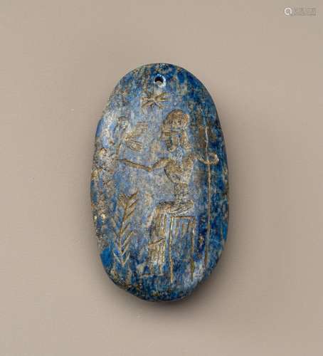 A BACTRIAN LAPIS LAZULI INTAGLIO TALISMAN WITH A FIGURE