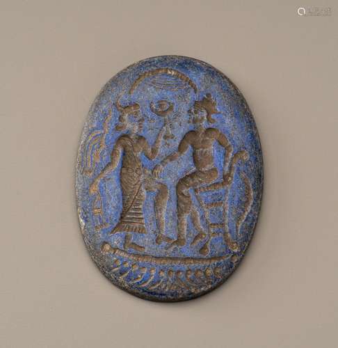 A BACTRIAN LAPIS LAZULI INTAGLIO PLAQUE WITH FIGURES