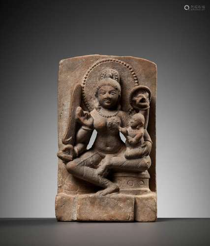 A RARE SANDSTONE MINATURE STELE FIGURE OF A MOTHER GODDESS W...