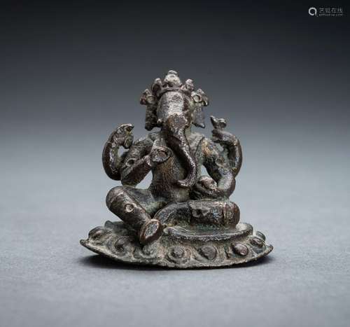 AN EARLY INDIAN BRONZE FIGURE OF GANESHA