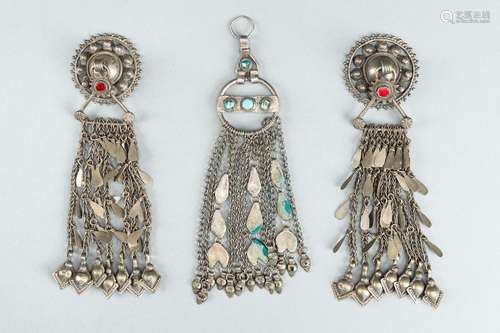 THREE TRIBAL AFGHAN METAL ORNAMENTS WITH INSETS, c. 1950s